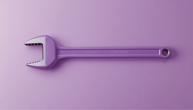 A pipe wrench resting on a surface, symbolizing the unseen burdens of building marketing data pipelines in-house